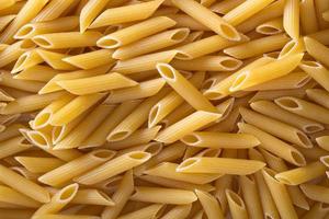 Pasta-Penne-Hintergrund foto