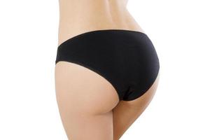 weibliche Gesäß und Vorlage leere Höschen Rückansicht Mock-up isoliert. Anti-Cellulite-Booty-Konzept. Hautpflege, Gesundheitswesen. nahaufnahme damenunterwäsche mit kopierraum. beschnittenes Bild. Körperpflege. Attrappe, Lehrmodell, Simulation foto