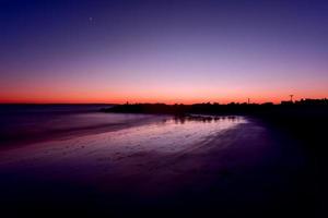 Sonnenuntergang am Strand von Coney Island foto