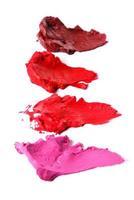 Verschiedene mehrfarbige Proben eines verschmierten Lippenstifts foto