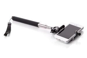 Smartphone auf einem Selfie-Stick foto