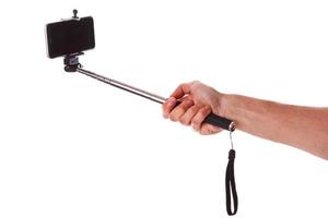 Smartphone auf einem Selfie-Stick foto