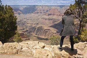 Fotograf, der am Grand Canyon schießt foto