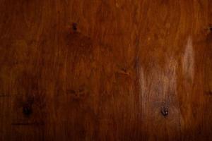 Vintage braune Holzhintergrundtextur mit Knoten und Nagellöchern. alte bemalte Holzwand. brauner abstrakter hintergrund. vintage hölzerne dunkle horizontale bretter. foto