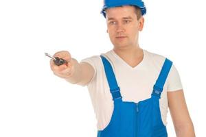 Builder mit Schraubendreher in der Hand foto