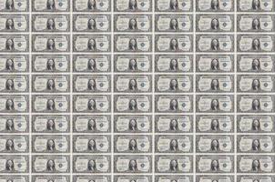 1 US-Dollar-Scheine, die im Geldproduktionsförderer gedruckt werden. Collage aus vielen Rechnungen. Konzept der Währungsabwertung foto