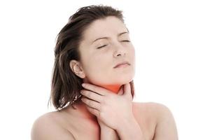 Frau mit Halsschmerzen foto