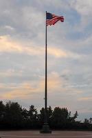 Usa-Flagge über Liberty Island foto