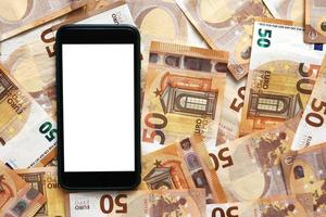 Smartphone mit leerem Display-Mockup-Bildschirm auf 50-Euro-Banknoten. Geld Papier. konzept von geschäfts-, investitions- und einkommenswachstum. moderne Technologie, Kommunikation und Online-Handel mit Gadget-Konzept foto