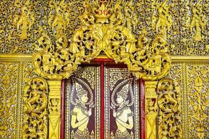 Fensterscheibe streift thailändische Kunst in Gold foto