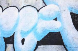 Textur eines Fragments der Wand mit Graffiti-Malerei, die darauf abgebildet ist. ein Bild einer Graffiti-Zeichnung als Foto zu Themen der Street Art und Graffiti-Kultur