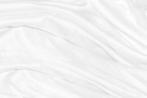 weißes Tuch Hintergrund abstrakt mit weichen Wellen. foto