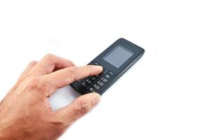 Hand drücken auf Telefon altes Handymodell isoliert auf weißem Hintergrund foto