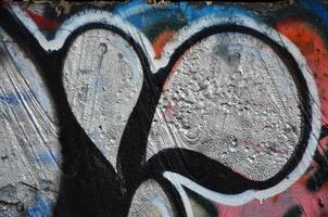 Textur eines Fragments der Wand mit Graffiti-Malerei, die darauf abgebildet ist. ein Bild einer Graffiti-Zeichnung als Foto zu Themen der Street Art und Graffiti-Kultur