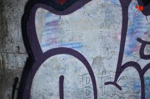 Nahaufnahme von Graffiti-Zeichnungsdetails. Hintergrundbild zum Thema Street Art und Vandalismus. Textur der Wand, bemalt mit Aerosolfarben foto