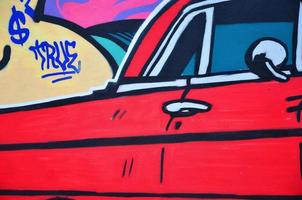 ein detailliertes Bild der Graffiti-Zeichnung. ein konzeptioneller Street-Art-Hintergrund mit einem roten Lowrider-Auto foto