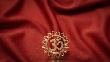 Das goldene Ohm-Hindu-Symbol auf roter Seide für das 3D-Rendering des Hintergrundkonzepts foto