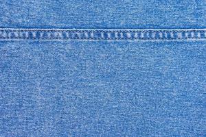 Blue Denim Jeans mit einem Nahtstrukturhintergrund foto