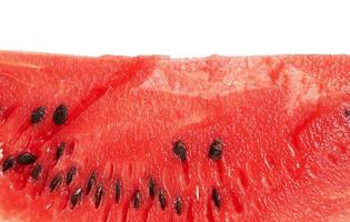 Textur der roten reifen Wassermelone mit braunen Samen foto