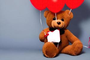 Überraschungsparty mit Teddybär und rotem Ballon foto