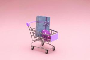 ostereier bunt im einkaufswagen auf rosa hintergrund. Platz für Text kopieren. foto