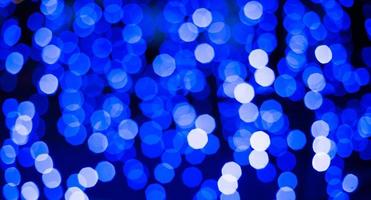 blauer Bokeh-Glitzerbeschaffenheits-Weihnachtszusammenfassungshintergrund foto