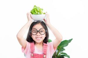 Kinder Mädchen Asien Gemüse essen foto