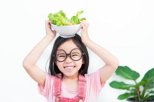 Kinder Mädchen Asien Gemüse essen foto