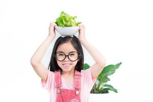 Kinder Mädchen Asien Gemüse essen foto