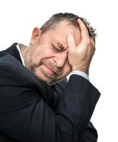 Mannporträt mit Kopfschmerzen foto