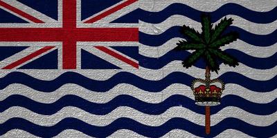 Flagge des britischen Überseegebiets des britischen Territoriums im Indischen Ozean auf einem strukturierten Hintergrund. Konzept-Collage. foto