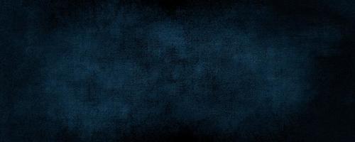 abstrakter dunkelblauer Farbhintergrund mit zerkratztem, modernem Hintergrundbeton mit rauer Textur, Tafel. raue stilisierte Textur der konkreten Kunst foto