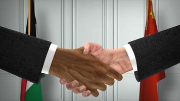 Geschäftstreffen der jordanischen und chinesischen Beamten. Diplomatie-Deal. Handschlag des Partners foto