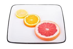 Grapefruit, Orange und Zitrone foto