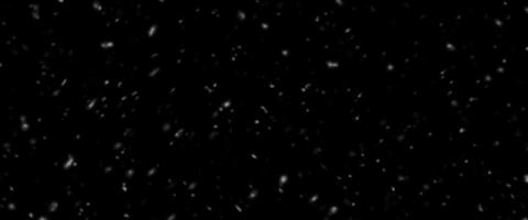 fallender Schnee auf schwarzem Hintergrund isoliert. fallender Schnee in der Nacht. Bokeh-Lichter auf schwarzem Hintergrund, fliegende Schneeflocken in der Luft. Winter Wetter foto