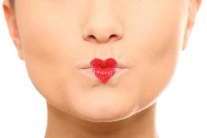 Frau mit herzförmigen Lippen foto