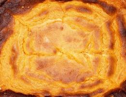 Textur von gebackenem Käsekuchen mit Kürbis foto