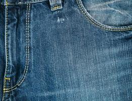 Fragment von Blue Jeans, Fliege auf der Hose foto