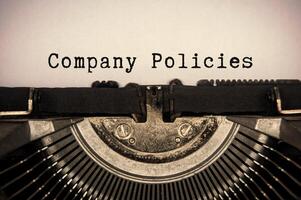 Unternehmen Richtlinien Text getippt auf ein alt Jahrgang Schreibmaschine. Unternehmen Politik Konzept.