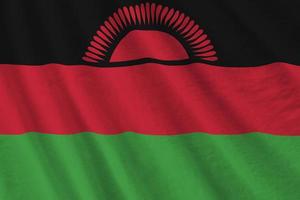 Malawi-Flagge mit großen Falten, die im Innenbereich unter dem Studiolicht wehen. die offiziellen symbole und farben im banner foto