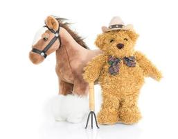 Teddybär-Bauer mit Heugabel und Pferd foto