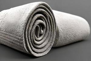 sauber hell grau Farbe rollen Handtuch nett und aufgeräumt zum Fitness, Bad, Baden, Massage und Spa Marketing Hintergrund und Design Material. foto
