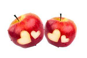zwei Äpfel mit Herzen auf ein Weiß Hintergrund foto