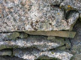 Textur von eben Steine gestapelt zu bilden ein Mauer foto