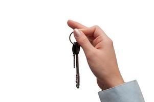 Hand hält Haus Schlüssel. Konzept von Kauf oder Verkauf Zuhause foto