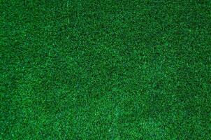 abstrakt oben Aussicht Grün Farbe von künstlich Gras Hintergrund Textur foto