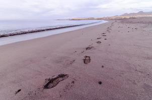 Fußabdrücke im Sand foto