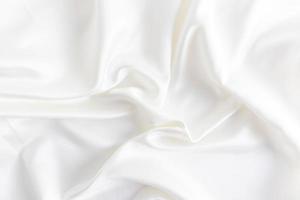 zart Hochzeit Hintergrund gemacht von Satin- Stoff mit Sanft Wellen. das Farbe von Sekt, Creme. Layout. foto