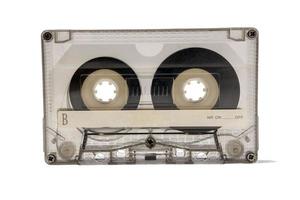 ein alt transparent Audio- Kassette zum ein Band Recorder isoliert auf ein Weiß Hintergrund foto