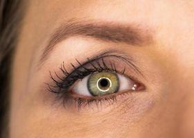 schön weiblich Grün Auge Nahansicht foto